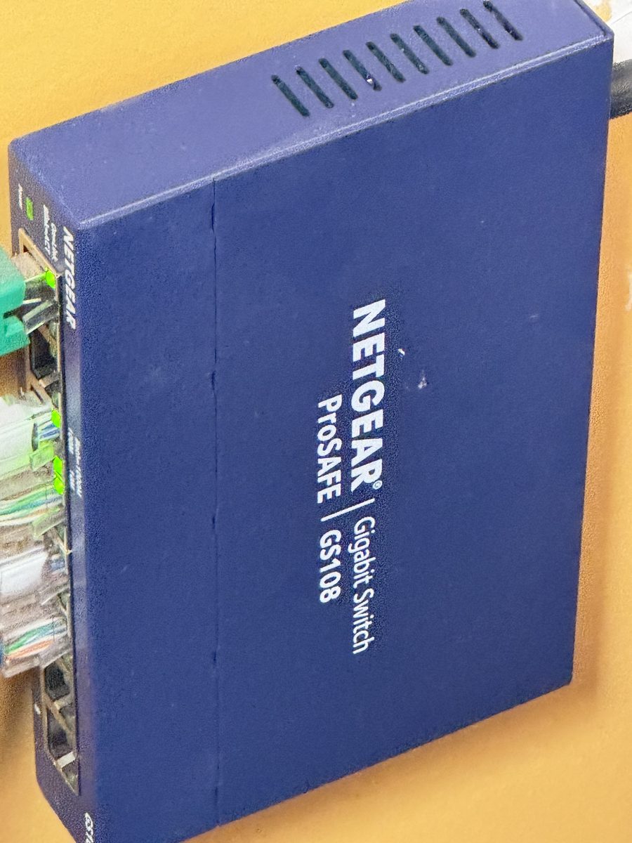Close-up of a network switch showing labeled port connections